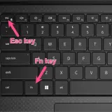 Klawiatura laptopa z zaznaczonymi klawiszami Esc i Fn. Naciśnij je, aby dowiedzieć się, jak włączyć podświetlenie klawiatury.