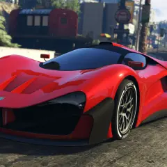 Czerwony supersamochód na drodze w Los Santos. Chcesz szybkich pojazdów w GTA 5? Kody pojazdy mogą pomóc!