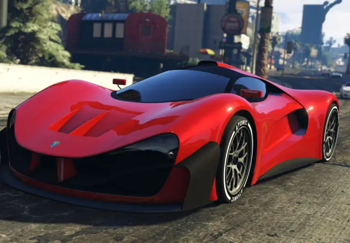 Czerwony supersamochód na drodze w Los Santos. Chcesz szybkich pojazdów w GTA 5? Kody pojazdy mogą pomóc!