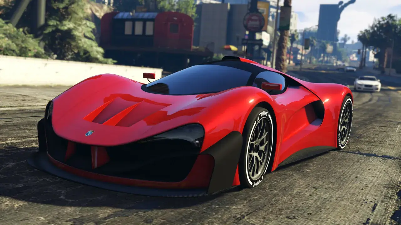 Czerwony supersamochód na drodze w Los Santos. Chcesz szybkich pojazdów w GTA 5? Kody pojazdy mogą pomóc!